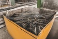 A pile of metal waste in the urn of an industrial plant. Recycling of iron waste and trash Royalty Free Stock Photo