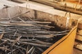 A pile of metal waste in the urn of an industrial plant. Recycling of iron waste and trash Royalty Free Stock Photo