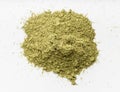 Pile of milled stevia rebaudiana herb on gray