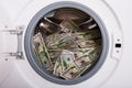 Pile Of Money In Washing Machine Royalty Free Stock Photo