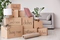 Pile of moving boxes and household stuff Royalty Free Stock Photo