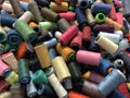 pile of multi-colored spools of thread close-up Royalty Free Stock Photo