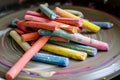 pile of multicolored chalk sticks on a potters wheel