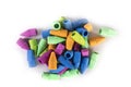 Pile of multicolored rubber pencil topper erasers pastel colors top down view