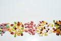 Pile of multicolored tasty gummy candies in different shapes isolated over white background Royalty Free Stock Photo