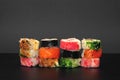 Pile of multiple hosomaki sushi on black background Royalty Free Stock Photo