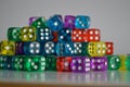 Pile of multiple coloured plastic arcylic d6 six sided die dice variable focus Royalty Free Stock Photo