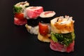 Pile of multiple hosomaki sushi on black background Royalty Free Stock Photo