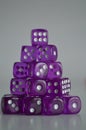 Pile of multiple purple plastic arcylic d6 six sided die dice variable focus
