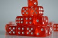Pile of multiple red plastic arcylic d6 six sided die dice variable focus