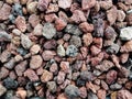 Pile of natural brownish porous volcanic rock stones used to decorate the garden or parts of the house indoor or outdoor