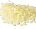 A Pile of Natural White Beeswax Pearls isolated on a White Background