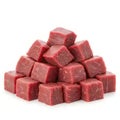 A pile of neatly cut raw beef cubes is arranged in a pyramid shape on white background. Royalty Free Stock Photo