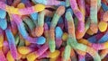 Pile of neon sugary gummy worms or  chewy sour crawlers background Royalty Free Stock Photo