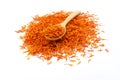 A pile of New Dried Safflower petals herb Tea on a wooden spoon.  on a white background Royalty Free Stock Photo