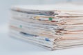 Pile of newspapers on table. Folded and stacked journals