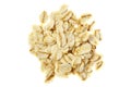 Pile of oat flakes isolated on a white background, top view. Oat flakes isolated on white background, top view. Heap of oatmeal