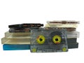 Pile of old audio cassetes isolated over white