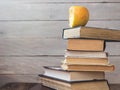 Pile of old books and bitten apple Royalty Free Stock Photo