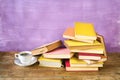 Pile of old books and a cup of coffee. Reading, learning, education, literature concept, panorama, copy space Royalty Free Stock Photo