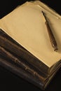 A pile of old books in leather bindings set aside for work on th Royalty Free Stock Photo