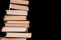 Pile of books on a black background Royalty Free Stock Photo