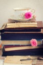 Pile of old books and mail with cup of tea Royalty Free Stock Photo