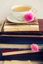 Pile of old books and mail with cup of tea Royalty Free Stock Photo