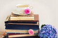 Pile of old books and mail with cup of tea Royalty Free Stock Photo