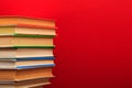 Pile of old books, panorma, good copy space  on red background Royalty Free Stock Photo