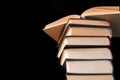 Pile of books on a black background Royalty Free Stock Photo