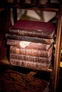 A pile of old books on a shelf Royalty Free Stock Photo