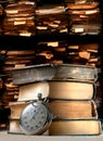 Pile of old books and stopwatch