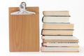 Pile of old books with wooden message board Royalty Free Stock Photo