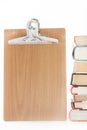 Pile of old books with wooden message board Royalty Free Stock Photo