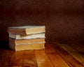 Pile of old books on wooden table Royalty Free Stock Photo