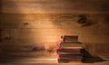 Pile of old books on wooden table Royalty Free Stock Photo