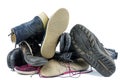 Pile of old boots isolated on the white background Royalty Free Stock Photo