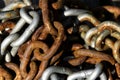 A pile of old brown gray rusted chain