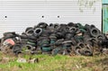 pile of old car tires. Industrial landfill for processing of waste tires, rubber tyres. Waste dump Royalty Free Stock Photo