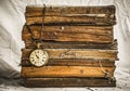 Pile of old dusty books with broken pocket watch on white cloth Royalty Free Stock Photo