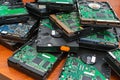 A pile of old dusty hard drives for disposal and recycling