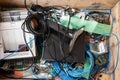 Pile of old electronic devices and cables ready for waste collection or recycling, no people
