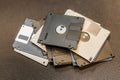 Pile of old floppy disks white, black and green against a dark background Royalty Free Stock Photo