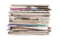 Pile of old newspapers and magazines, stack, side view, isolated on white background Royalty Free Stock Photo