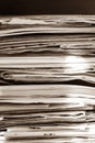 Pile of old newspapers and magazines, stack, side view.  Vintage background Royalty Free Stock Photo