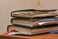 Pile of old notebooks of the student on table