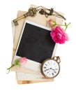 Pile of old photos with antique clock, key and roses Royalty Free Stock Photo