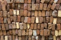 Pile of old red bricks stacked in even rows. rough surface texture Royalty Free Stock Photo