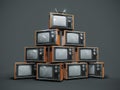 Pile of old retro TVs on dark background Royalty Free Stock Photo